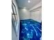 Bright bedroom with closet, light walls and eye catching blue and white floors at 3499 Lake Mill Rd, Buford, GA 30519