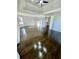 Large main bedroom with tray ceiling, hardwood floors, and ample natural light at 3499 Lake Mill Rd, Buford, GA 30519