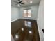 Bedroom with ceiling fan, refinished hardwood floors, and natural lighting at 3499 Lake Mill Rd, Buford, GA 30519