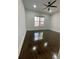 Bedroom with hardwood floors, a large window, and ample natural light at 3499 Lake Mill Rd, Buford, GA 30519