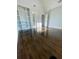 Spacious bedroom with hardwood floors, built-in shelving, and ample natural light at 3499 Lake Mill Rd, Buford, GA 30519