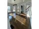 Bright dining area with beautiful hardwood floors and modern lighting at 3499 Lake Mill Rd, Buford, GA 30519