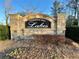 Elegant entrance sign to Thompson Mill Lakes community, creating a welcoming and upscale neighborhood atmosphere at 3499 Lake Mill Rd, Buford, GA 30519
