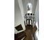 Elegant foyer view from above, featuring a decorative chandelier and front door at 3499 Lake Mill Rd, Buford, GA 30519