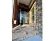 Elegant stone accents highlight the beautiful front entrance with a decorative glass door at 3499 Lake Mill Rd, Buford, GA 30519