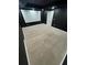 Home theater room with tiered seating, projector screen, and dark walls at 3499 Lake Mill Rd, Buford, GA 30519