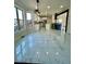 Spacious kitchen with white cabinets, marble floors, stainless steel appliances, and modern lighting at 3499 Lake Mill Rd, Buford, GA 30519