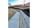 Backyard landscaping with retaining wall, shrubs and lawn at 3499 Lake Mill Rd, Buford, GA 30519