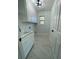 Clean laundry room with a sink, plenty of storage, and natural light at 3499 Lake Mill Rd, Buford, GA 30519