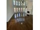 Spacious living room with soaring ceilings, a fireplace, lots of natural light, and hardwood floors at 3499 Lake Mill Rd, Buford, GA 30519