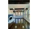 Inviting living room with backyard view, a fireplace, and dark exposed beams at 3499 Lake Mill Rd, Buford, GA 30519