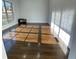 Spacious living room featuring gleaming hardwood floors and abundant natural light at 3499 Lake Mill Rd, Buford, GA 30519