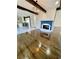 Open living room with a cozy fireplace and modern kitchen appliances at 3499 Lake Mill Rd, Buford, GA 30519