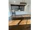 Bright open-concept living area featuring hardwood floors and views of the kitchen at 3499 Lake Mill Rd, Buford, GA 30519
