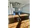 Primary bedroom with refinished hardwood floors and tray ceiling with ceiling fan at 3499 Lake Mill Rd, Buford, GA 30519