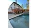 Inviting in-ground pool surrounded by a spacious deck, perfect for relaxation and entertainment at 3499 Lake Mill Rd, Buford, GA 30519