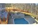 Inviting backyard pool with stone patio, outdoor kitchen, and deck at 3499 Lake Mill Rd, Buford, GA 30519