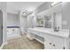 Bright bathroom featuring double sink vanity, jetted tub, and separate shower with tile flooring at 221 The Esplanade Se Way, Loganville, GA 30052