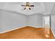 Spacious bedroom with tray ceiling, light colored walls, and wood flooring at 221 The Esplanade Se Way, Loganville, GA 30052