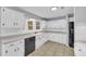 Kitchen featuring white cabinets and black appliances at 221 The Esplanade Se Way, Loganville, GA 30052