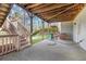 Back patio with a covered section underneath the deck overlooking the grassy yard at 3369 Arbor Path Dr, Atlanta, GA 30340