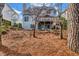 Back exterior of home with stairs from the deck to the back yard at 3369 Arbor Path Dr, Atlanta, GA 30340