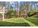 Backyard with grass, trees, and a fence defining the property at 3369 Arbor Path Dr, Atlanta, GA 30340