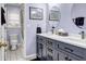 Modern bathroom featuring a double vanity, tiled floors and ample lighting at 3369 Arbor Path Drive Dr, Atlanta, GA 30340