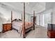 Spacious bedroom featuring a four-poster bed and an adjoining bathroom at 3369 Arbor Path Drive Dr, Atlanta, GA 30340