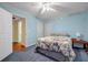 Cozy bedroom features light blue walls, carpet, and access to a bathroom at 3369 Arbor Path Dr, Atlanta, GA 30340