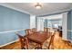 Dining area with wooden table, ample seating, and open view to the living area at 3369 Arbor Path Drive Dr, Atlanta, GA 30340