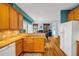 Cozy open kitchen with wooden cabinets and a view into the living area at 3369 Arbor Path Drive Dr, Atlanta, GA 30340