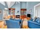 Bright living room with high ceilings, built-in shelves, and comfortable blue furniture at 3369 Arbor Path Drive Dr, Atlanta, GA 30340