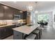 Modern kitchen with stainless steel appliances, granite countertops and an island with seating at 388 Pratt Se Dr # 2134, Atlanta, GA 30315