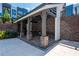 An outdoor kitchen features brick columns, stone floors, and a stainless steel sink at 388 Pratt Se Dr # 2134, Atlanta, GA 30315