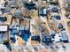 Aerial view of neighborhood homes with mature trees, fenced yards and a street in a suburban community at 449 South Hill St., Buford, GA 30518