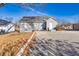 This backyard with patio area and manicured lawn offers a perfect blend of relaxation and entertainment space at 449 South Hill St., Buford, GA 30518