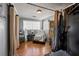 Salon room featuring curtains, hardwood floors, and furniture at 449 South Hill St., Buford, GA 30518