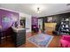 Spacious salon showcases hardwood floors, vibrant walls, and stylish furnishings at 449 South Hill St., Buford, GA 30518