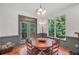 Inviting dining area features a wood table, access to the deck, and natural light at 718 Fincher Rd, Covington, GA 30016