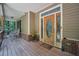 Inviting covered front porch with a decorative front door and classic rocking chairs at 718 Fincher Rd, Covington, GA 30016