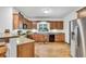 Spacious kitchen featuring stainless steel appliances, wood cabinets, and ample counter space at 718 Fincher Rd, Covington, GA 30016