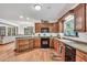 This kitchen features wood cabinets, great countertops, and access to the dining area and living space at 718 Fincher Rd, Covington, GA 30016