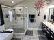 Bathroom featuring dual vanity sinks, a glass shower, and gray flooring at 209 Crestmont Way, Canton, GA 30114