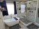 Main bathroom featuring a soaking tub, a glass shower, and gray flooring at 209 Crestmont Way, Canton, GA 30114