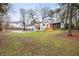 The large backyard features a multi-level deck, mature trees and ample room to play at 2508 Brookwood Ne Dr, Atlanta, GA 30305