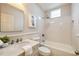 This bathroom is equipped with shower over tub, stylish vanity, and classic subway tile at 2508 Brookwood Ne Dr, Atlanta, GA 30305