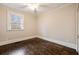 A sunny bedroom featuring hardwood floors, neutral paint and a large window with natural light at 2508 Brookwood Ne Dr, Atlanta, GA 30305