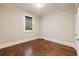 An ample bedroom with hardwood floors, neutral paint and natural light through one window at 2508 Brookwood Ne Dr, Atlanta, GA 30305