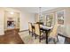 Elegant dining room with hardwood floors, wainscoting, and bay windows overlooking the front yard at 2508 Brookwood Ne Dr, Atlanta, GA 30305